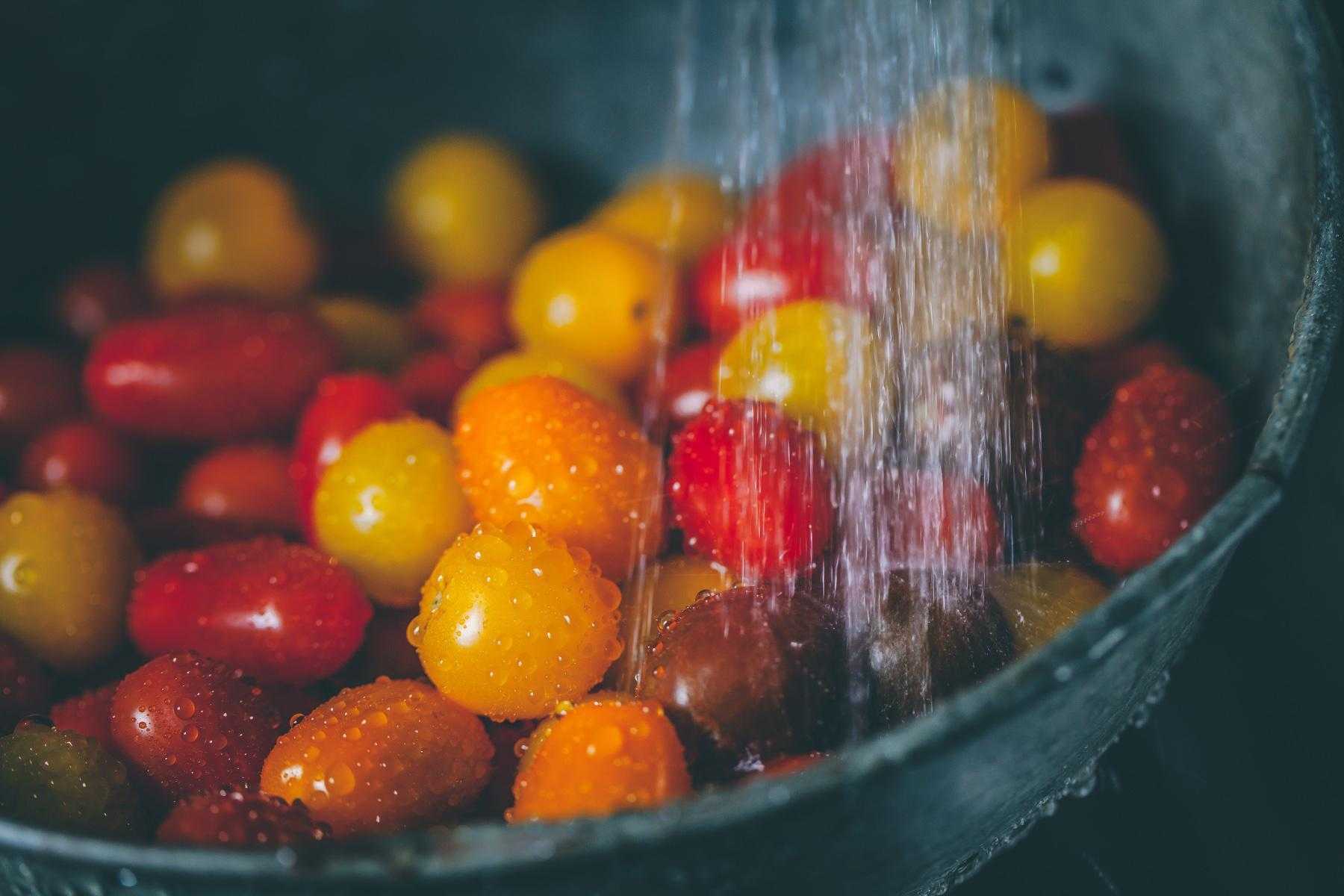 close-up of water on a bowl of cherry tomatoes