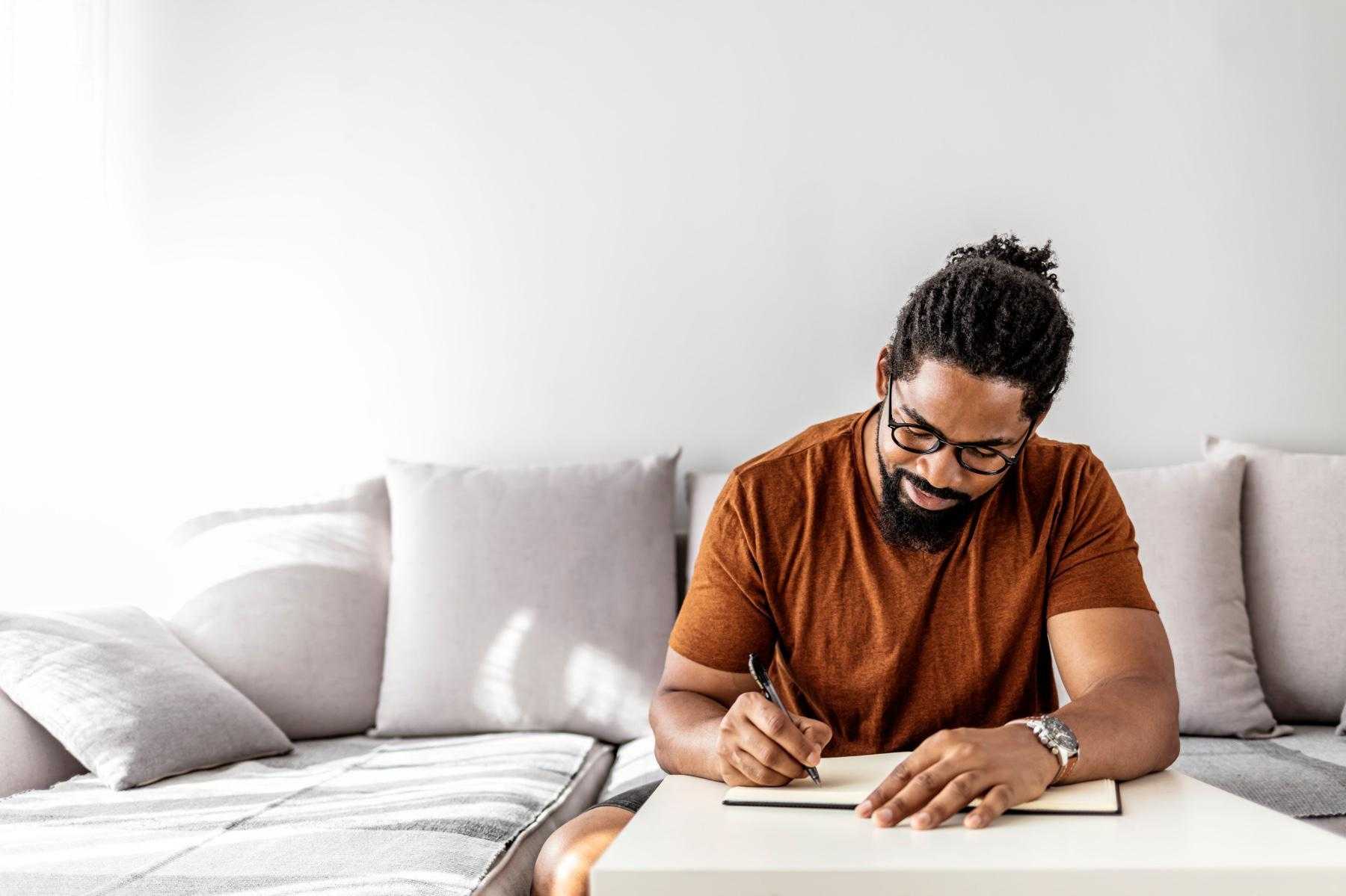 A man writing in his journal.