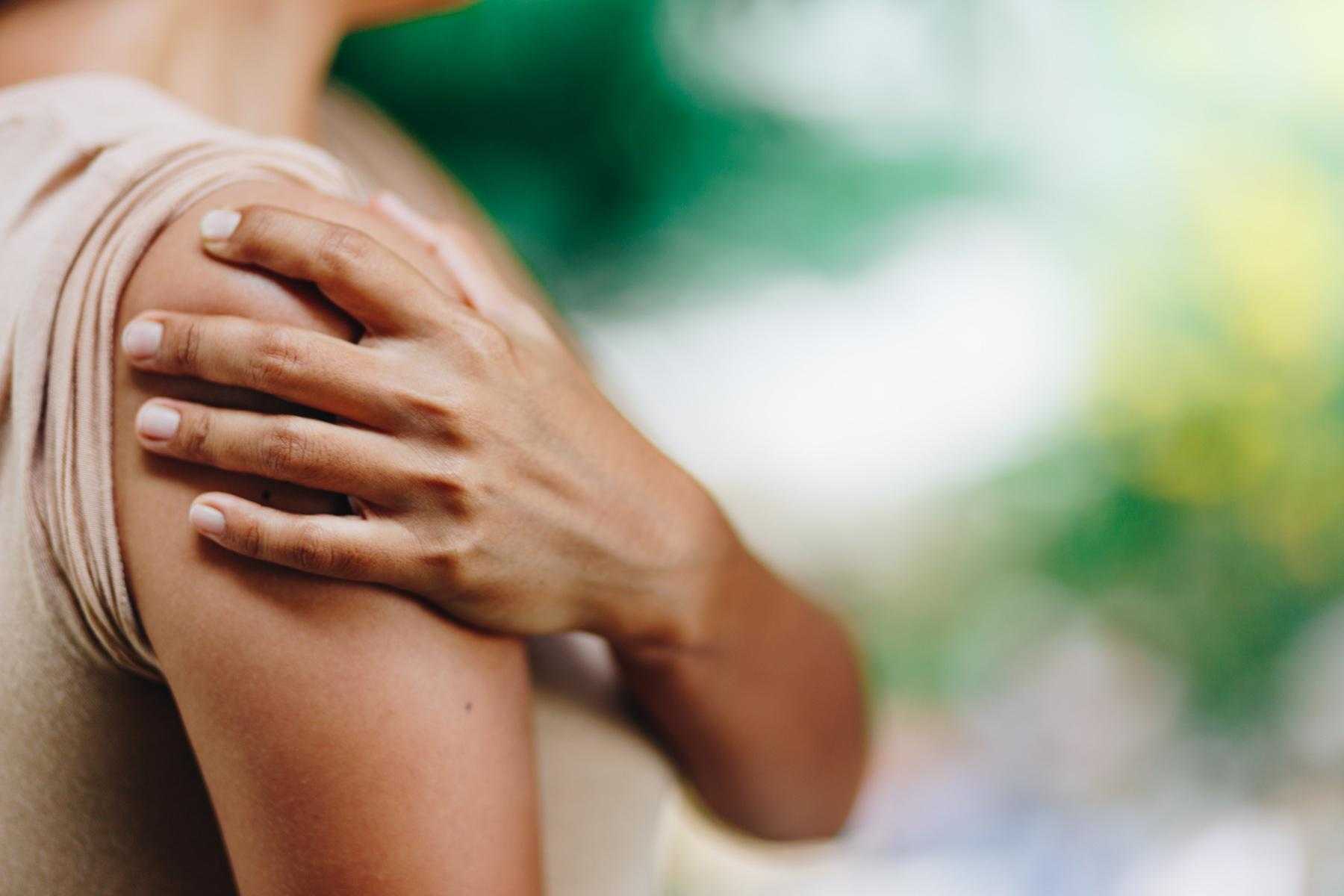 close-up of hand on shoulder