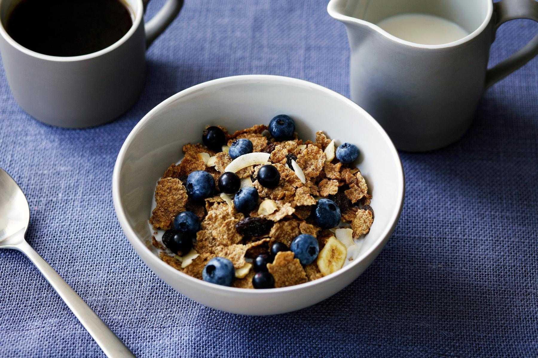 close-up of a bowl of healthy cereal with blueberries on top