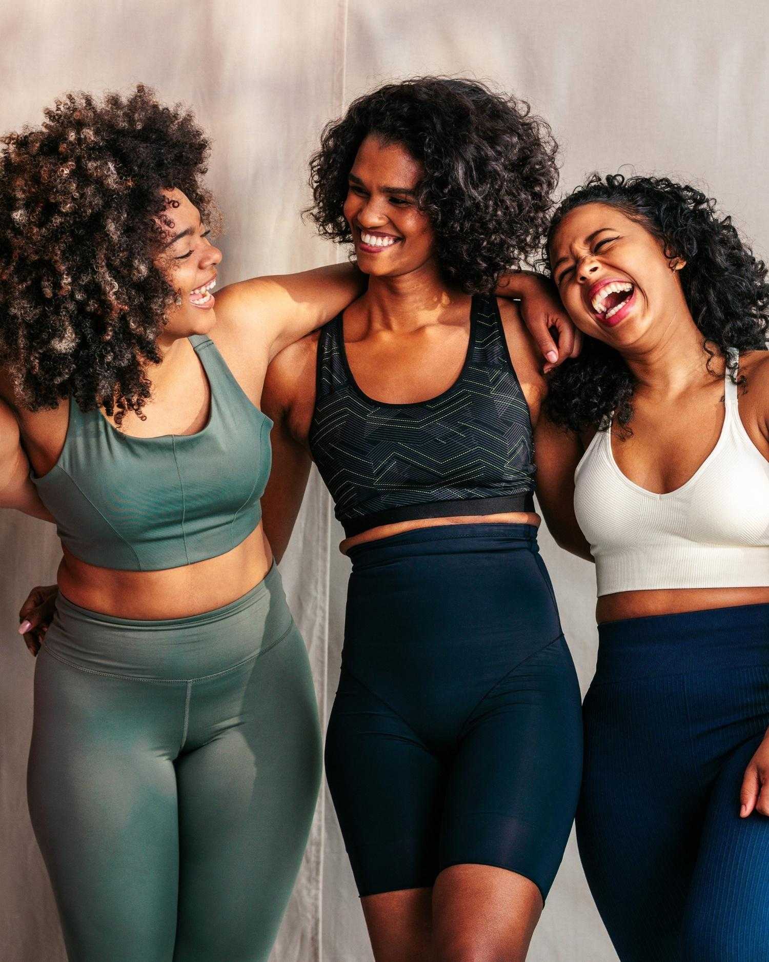 a group of three women laughing