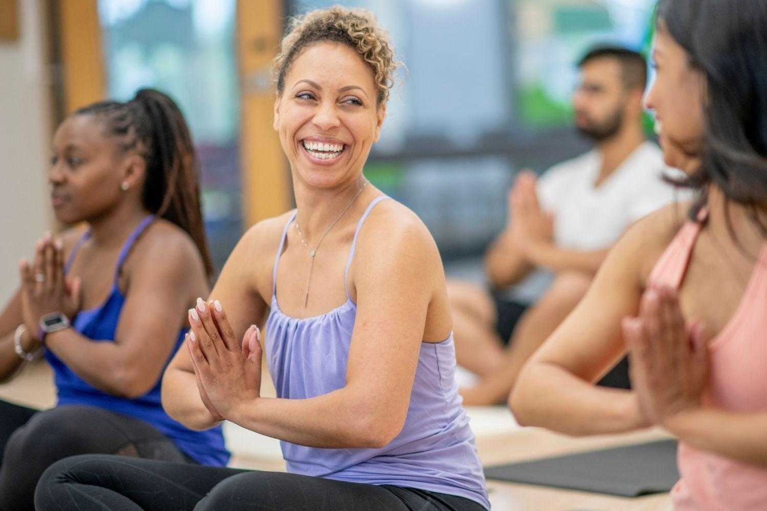 women in a group yoga class