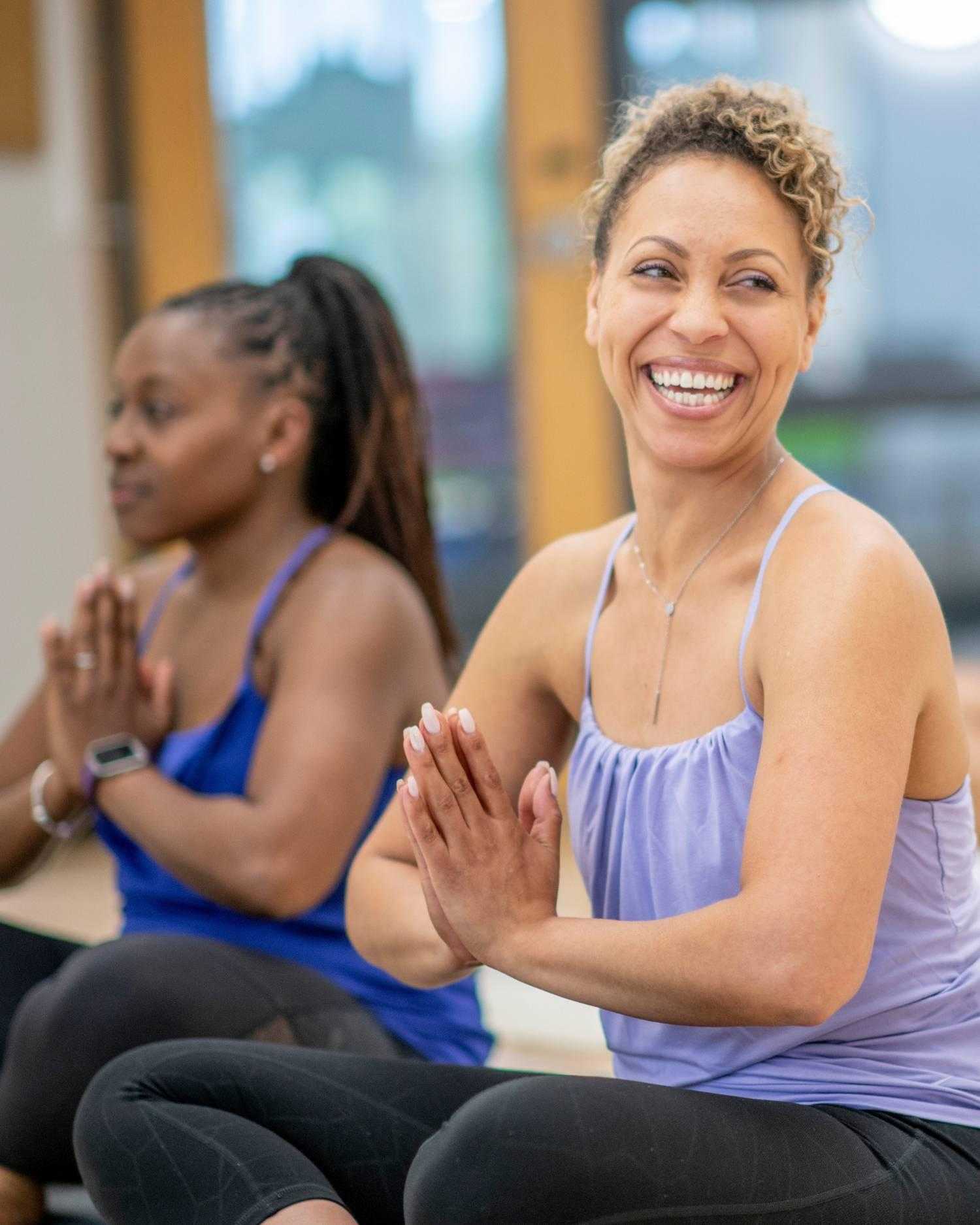 women in a group yoga class