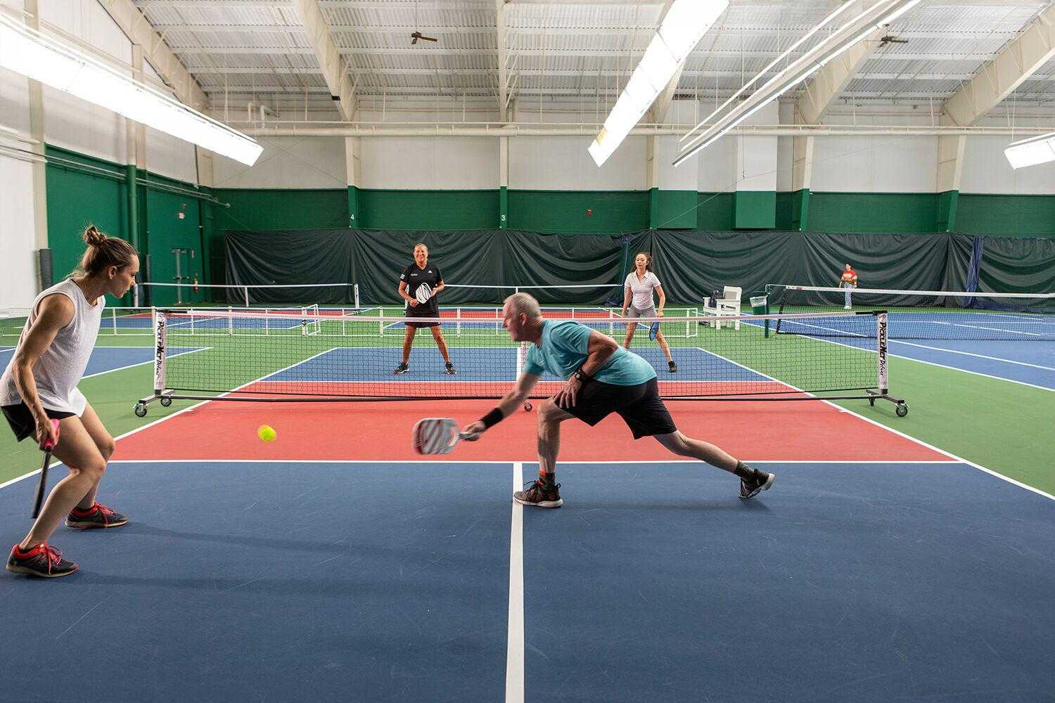 Two couples playing pickleball at Canyon Ranch Lenox