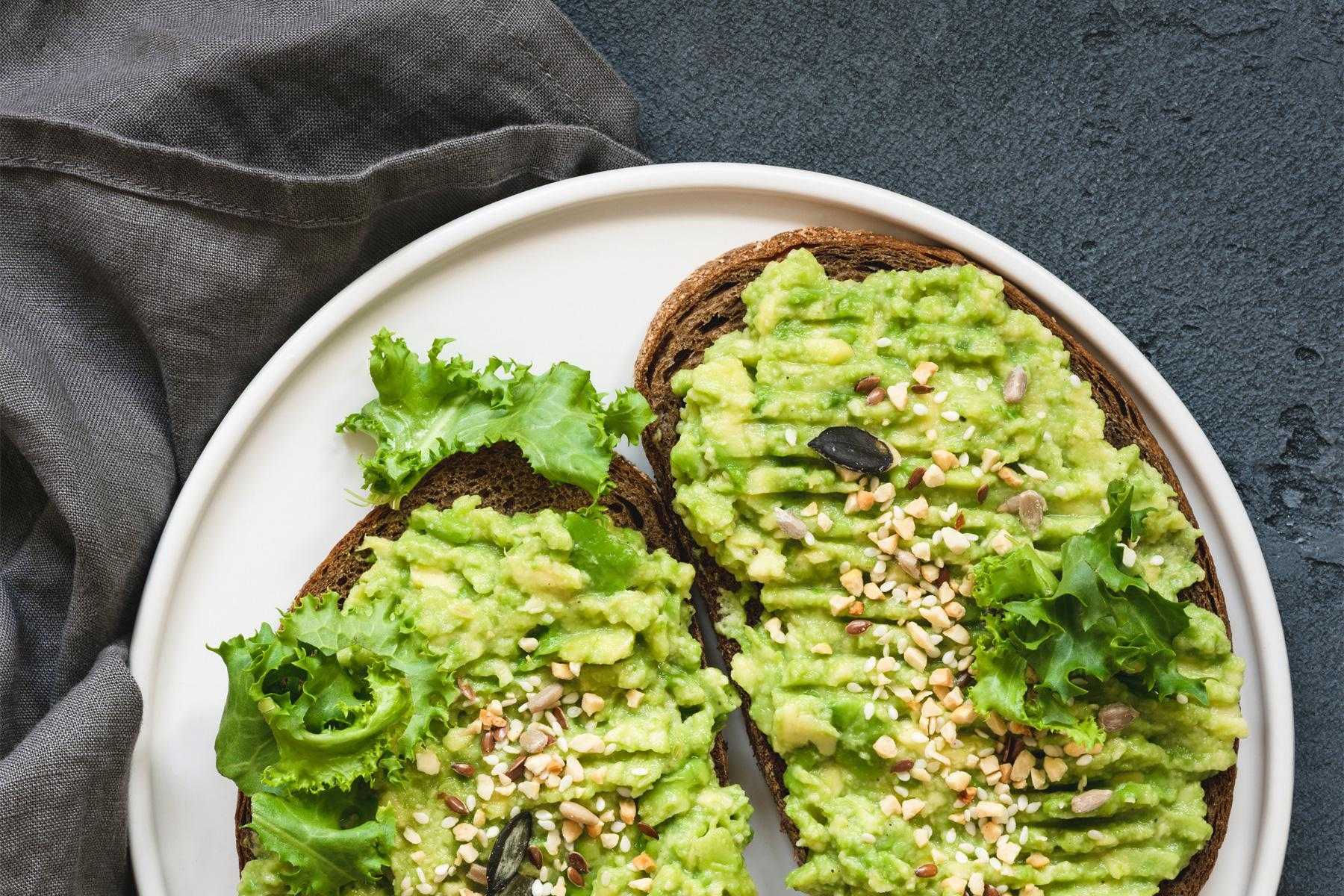 overhead view of plate with two slices of avocado toast