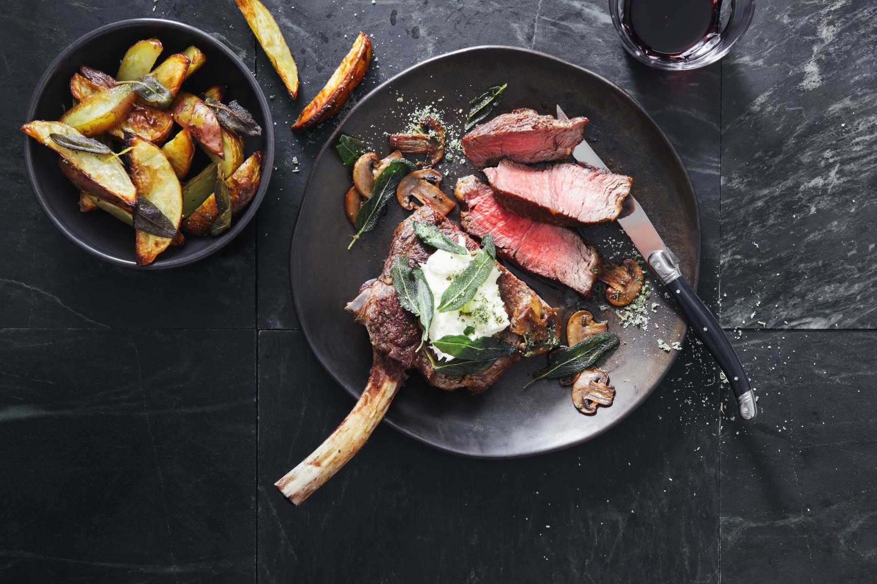 overhead view of a cooked steak on a plate