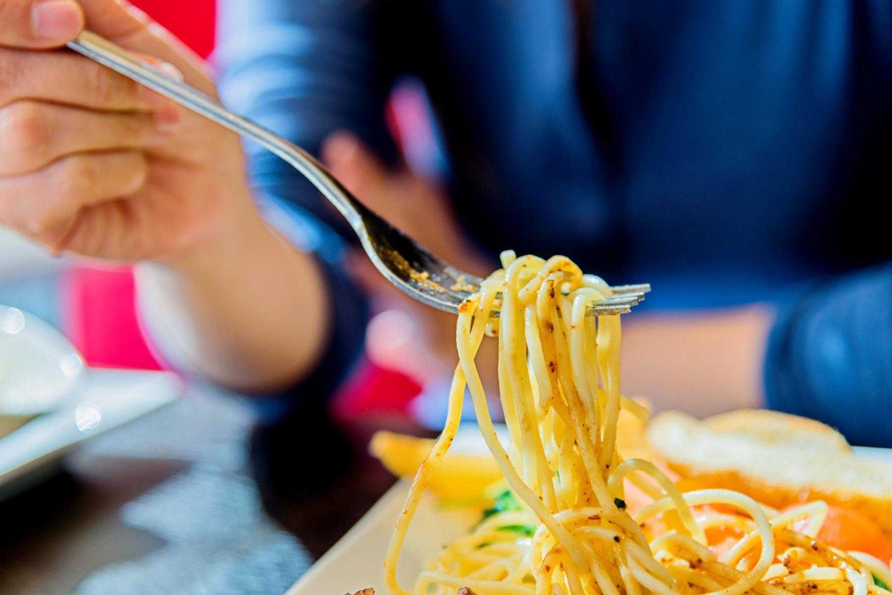 close-up of fork with spaghetti noodles on it