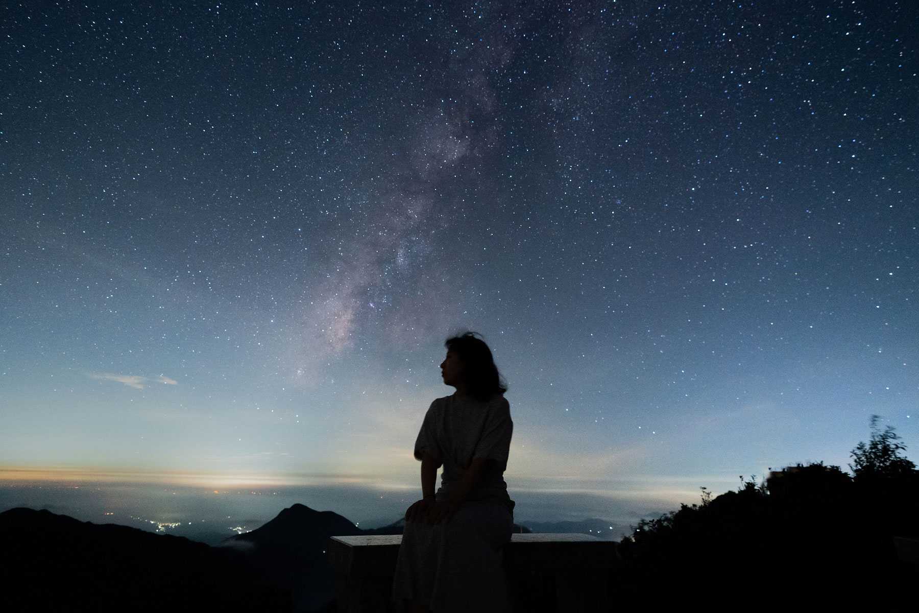 a woman sitting in the stars