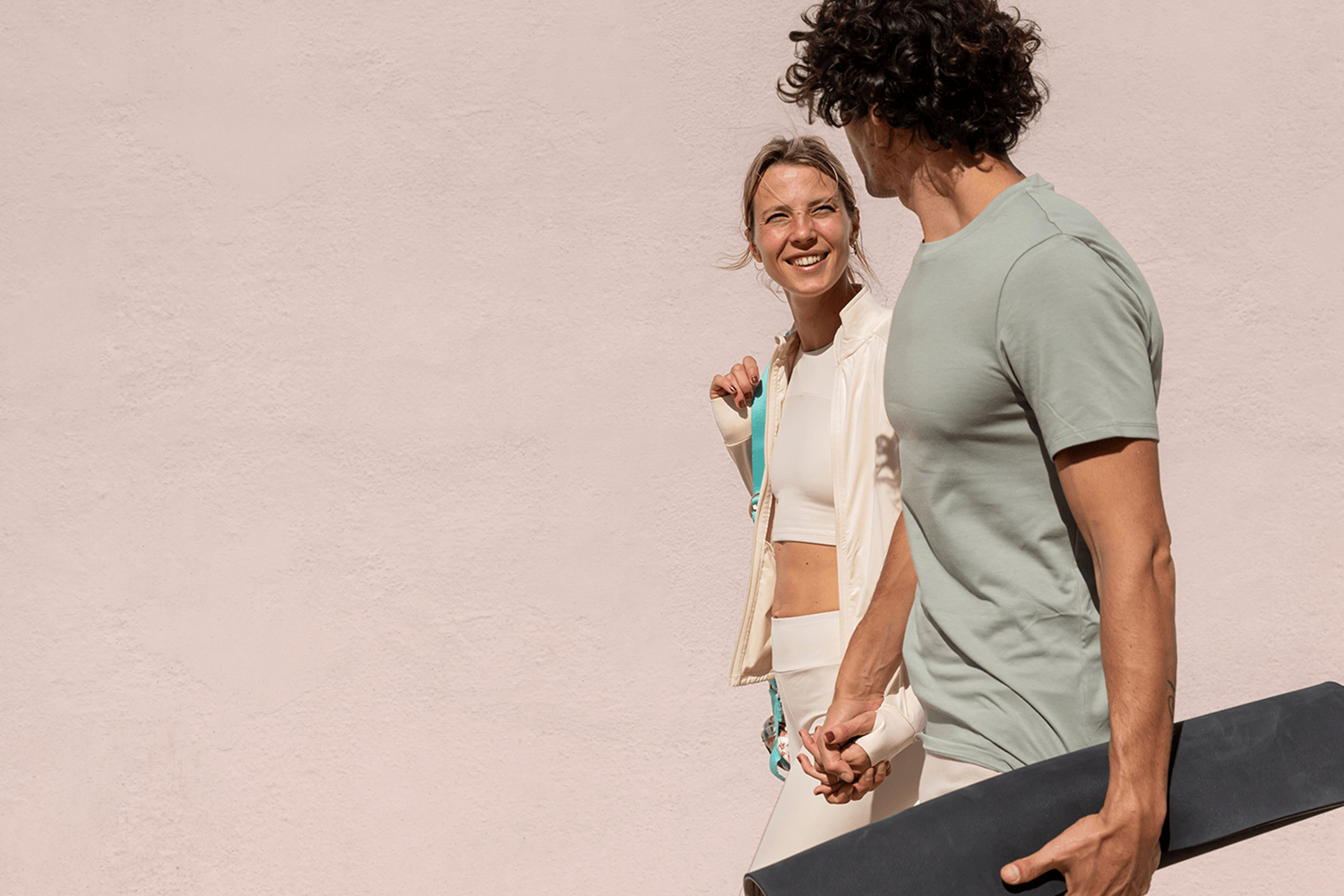 A man and woman walking to yoga class