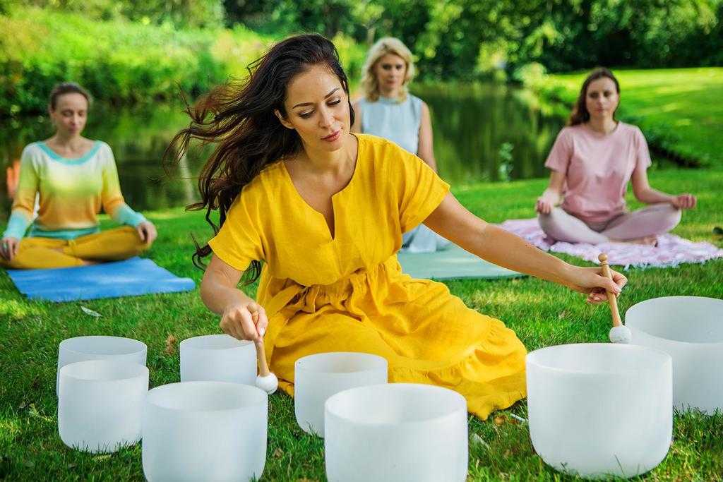 A group having a sing along by a campfire