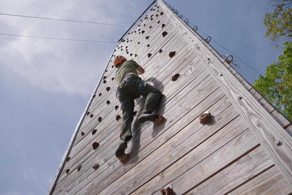 A man climbing on a wall