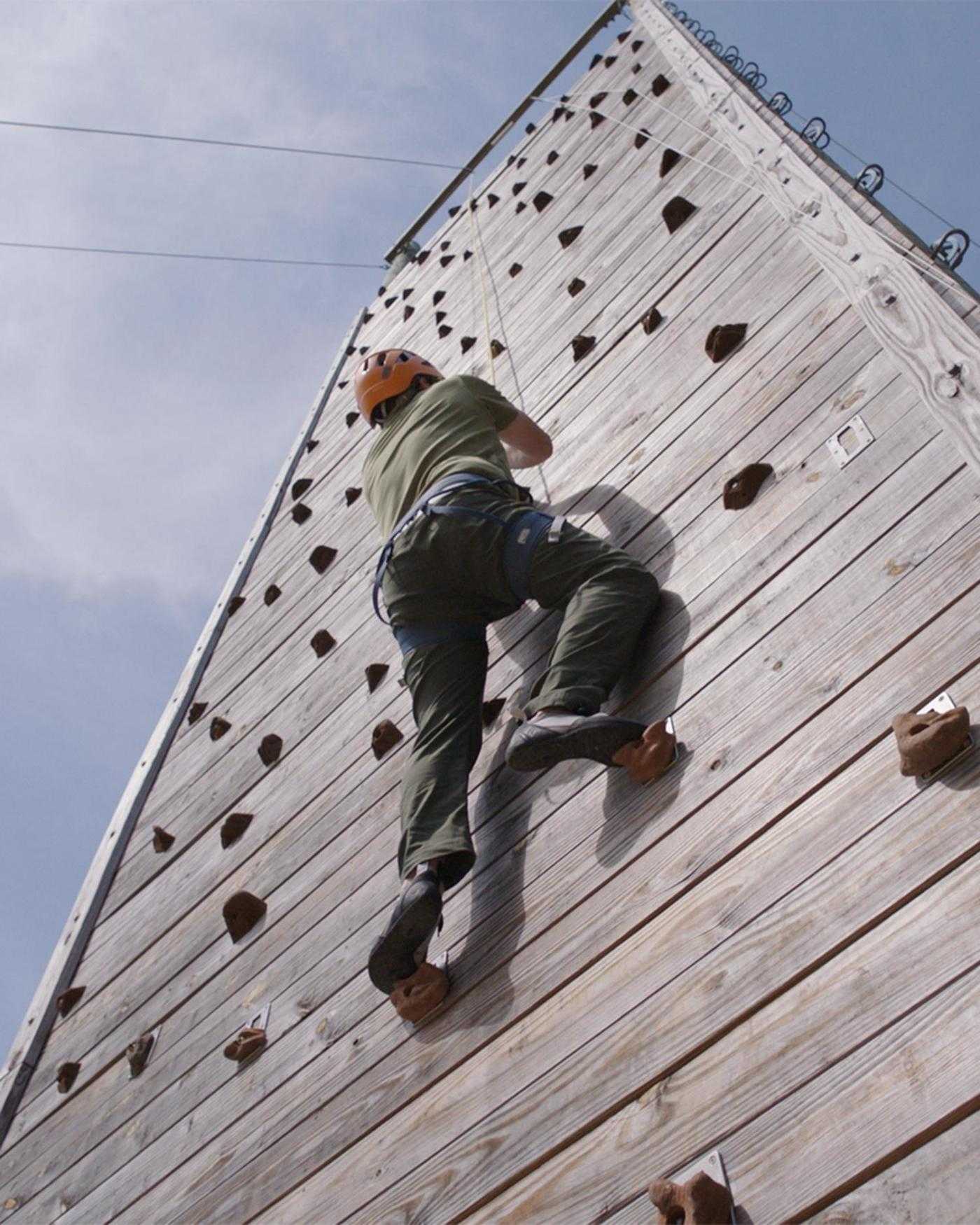 A man climbing on a wall