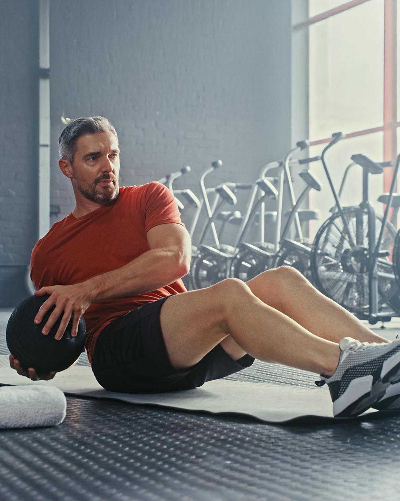 A man working out with a medicine ball