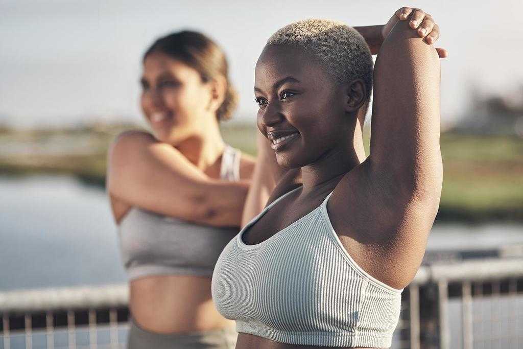 two women stretching