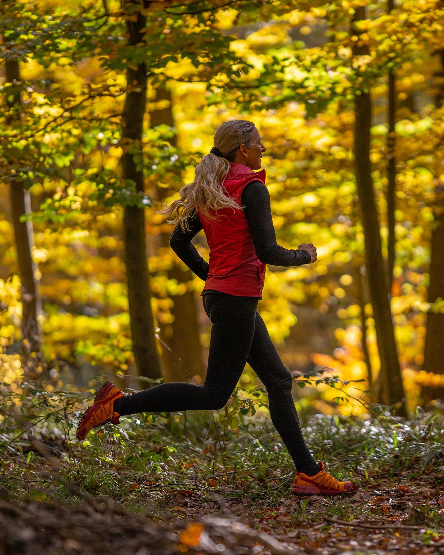 a woman running in the Berkshire Forest
