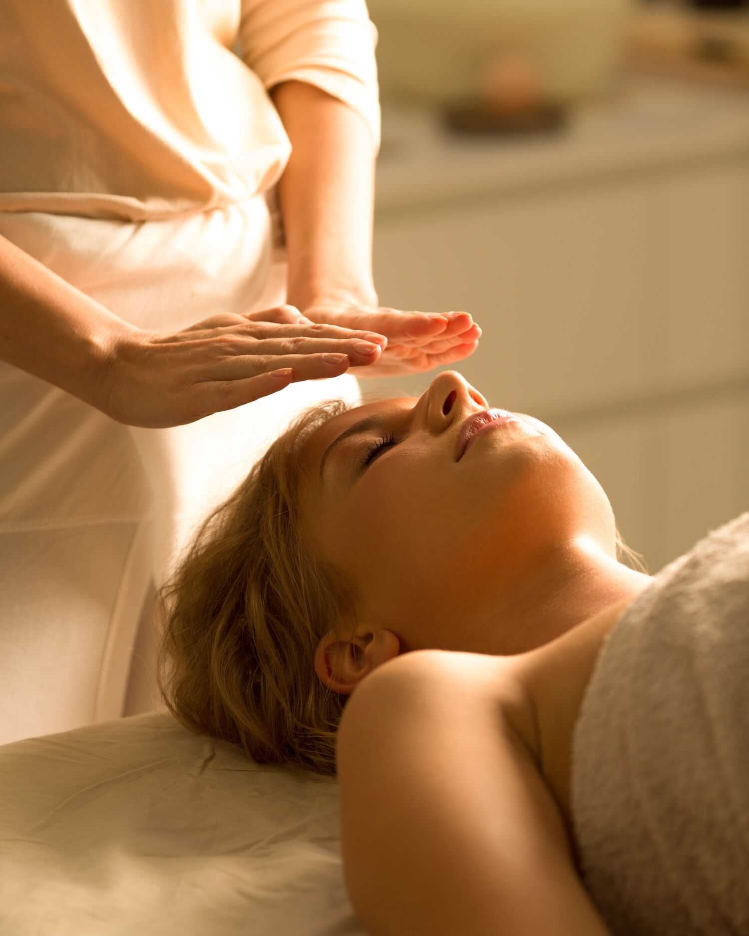 A woman getting a reiki healing