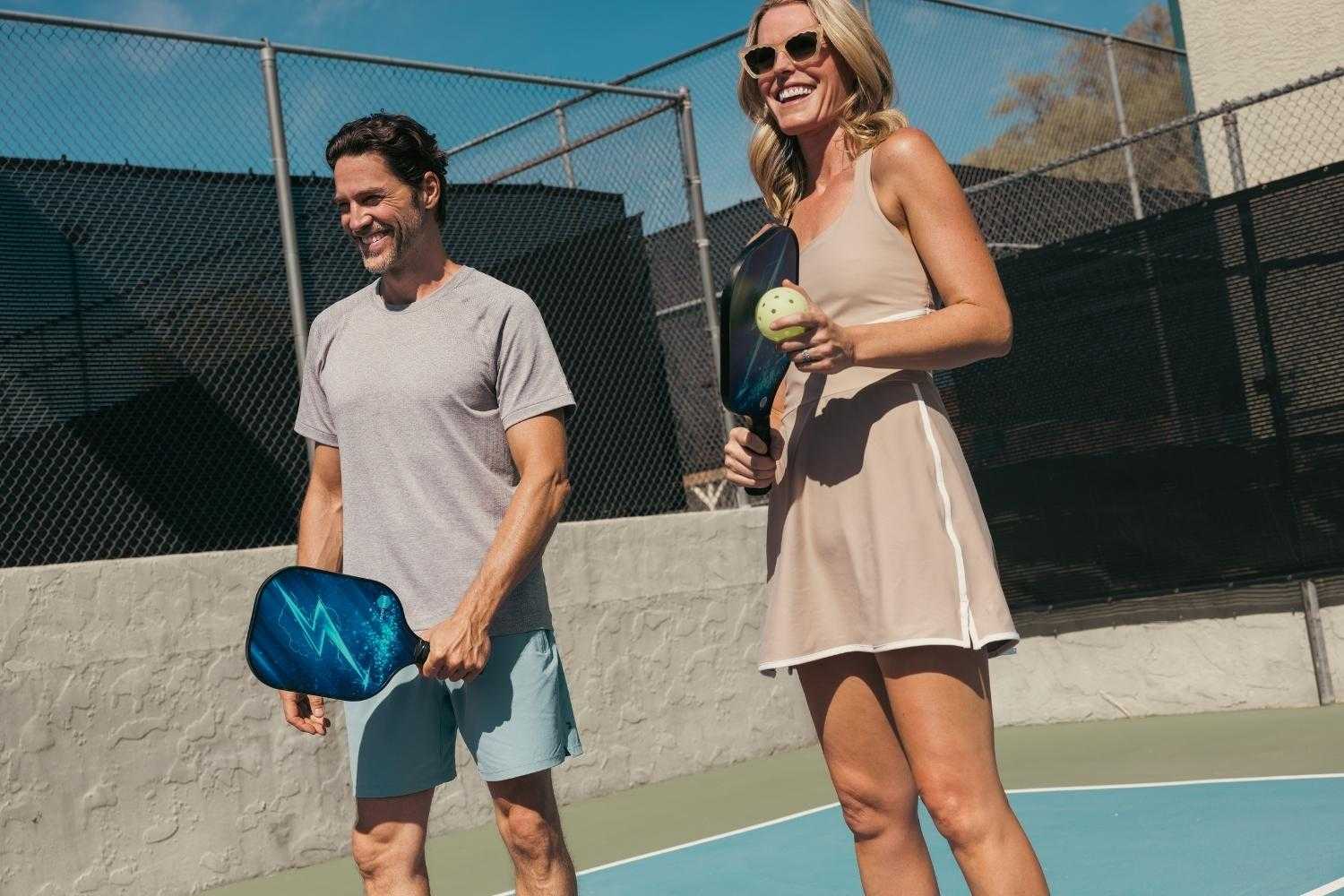 a couple playing pickleball