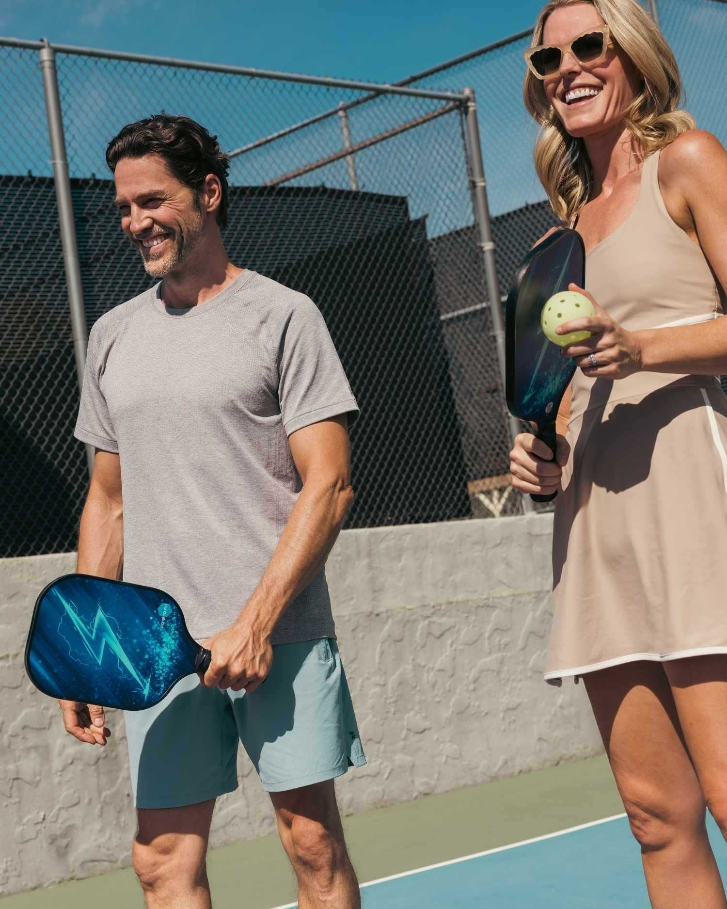 a couple playing pickleball