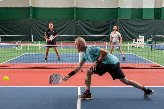 a group playing pickleball