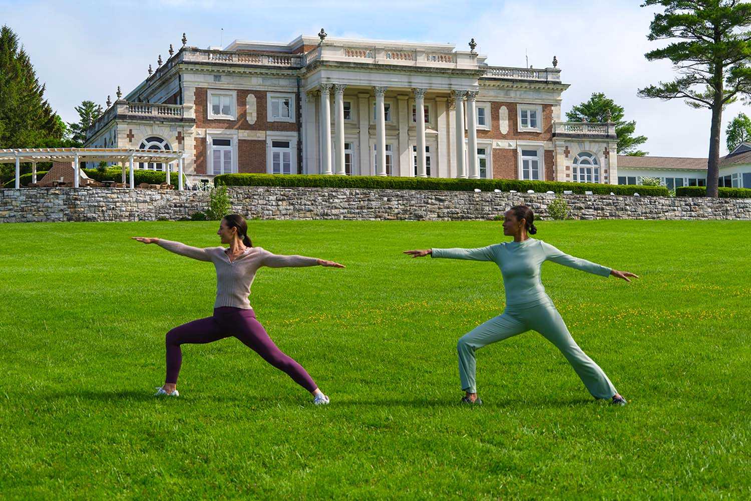 two women working out in front of the Lenox Mansion