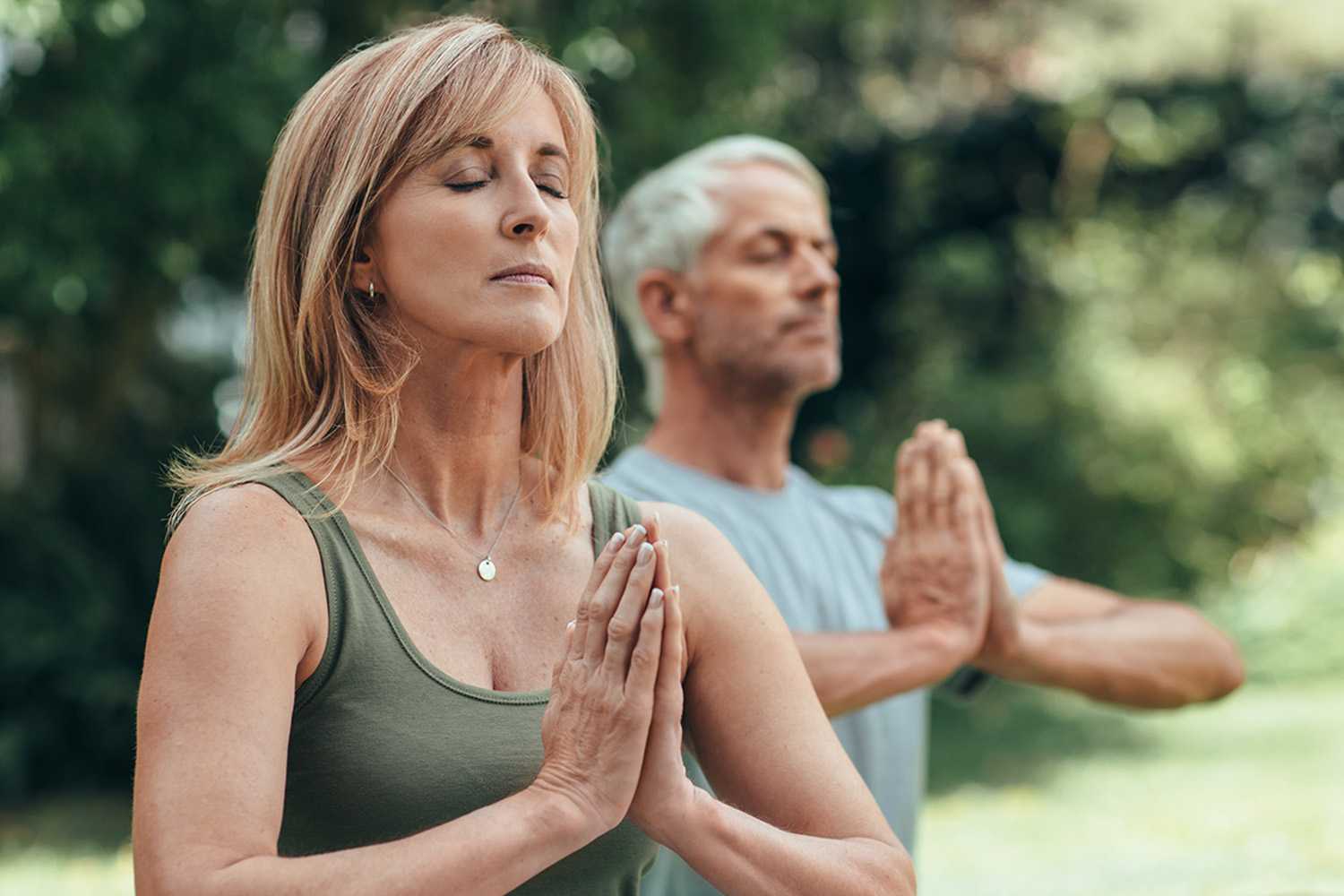 A man and woman meditating