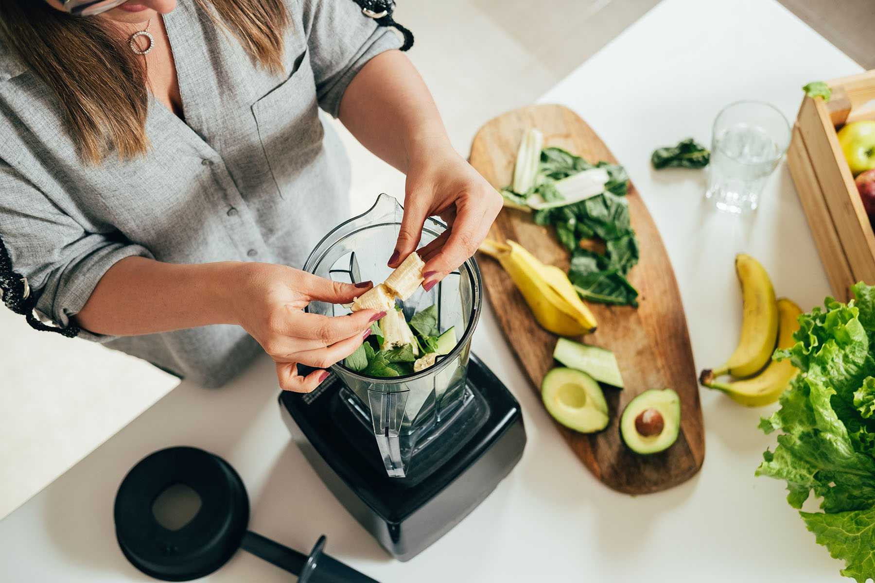 a woman preparing an Avocado Hemp Smoothie  