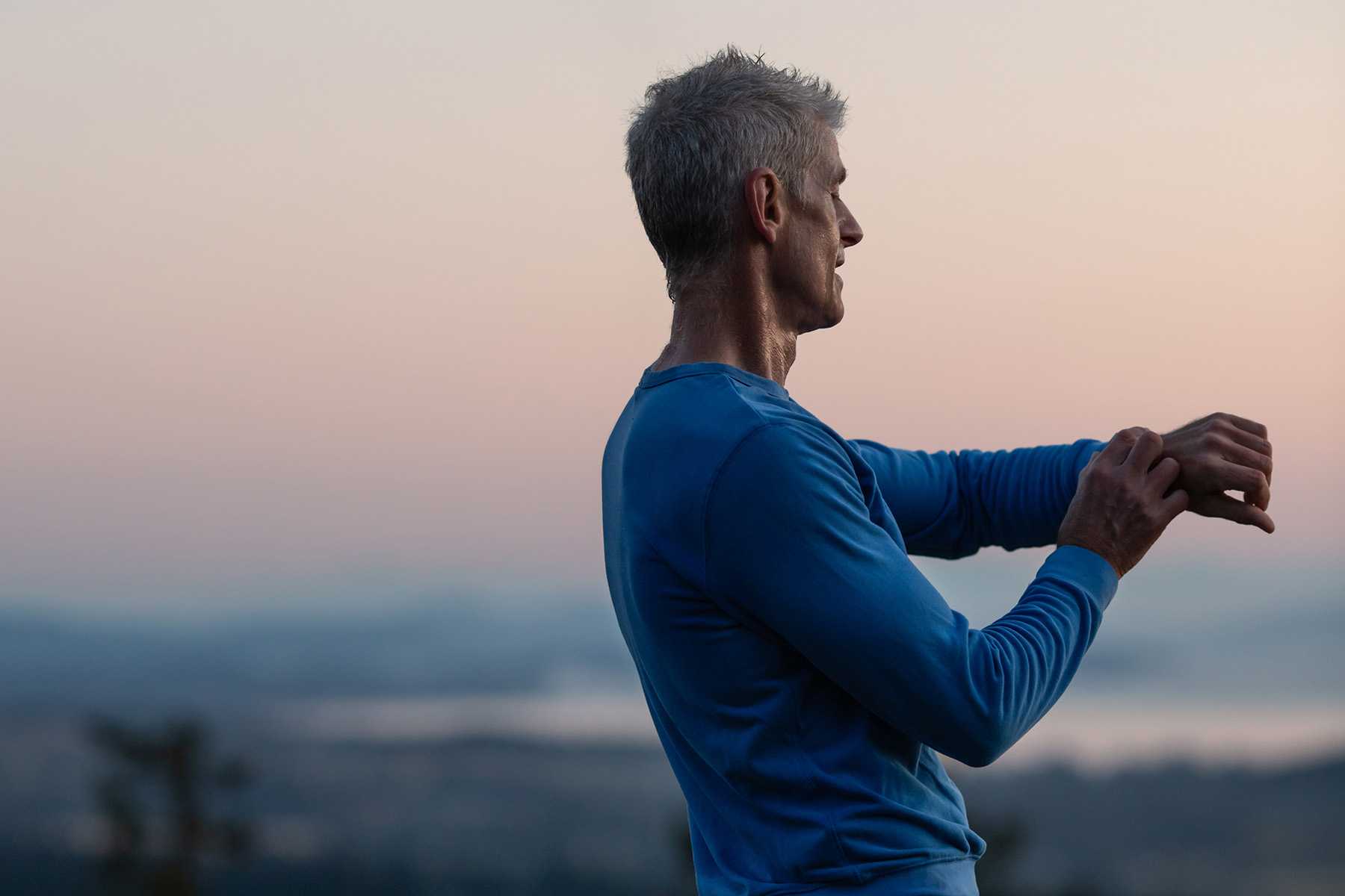 Man looking at his fitness tracker