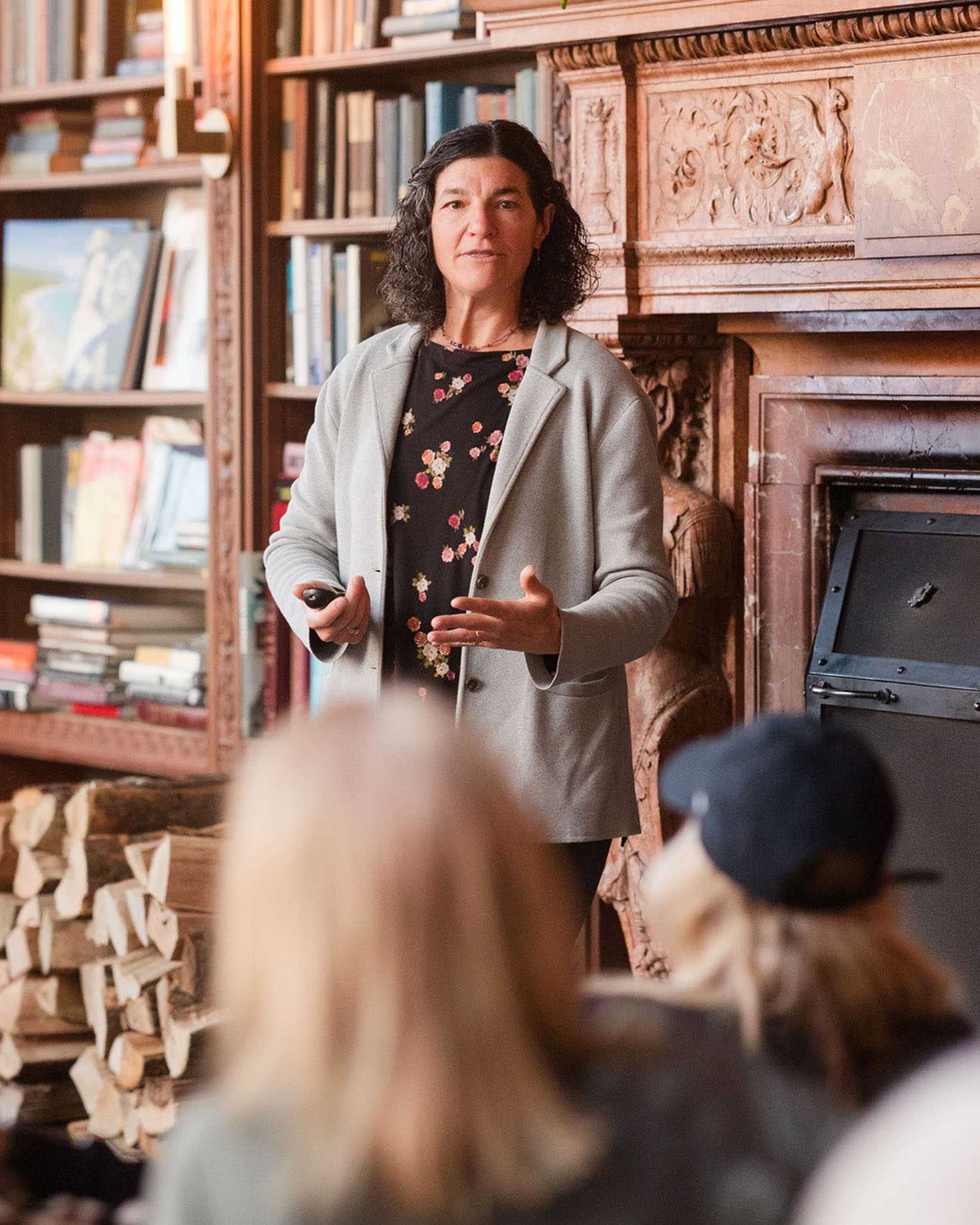 a woman giving a lecture at Canyon Ranch Lenox in the Mansion Library