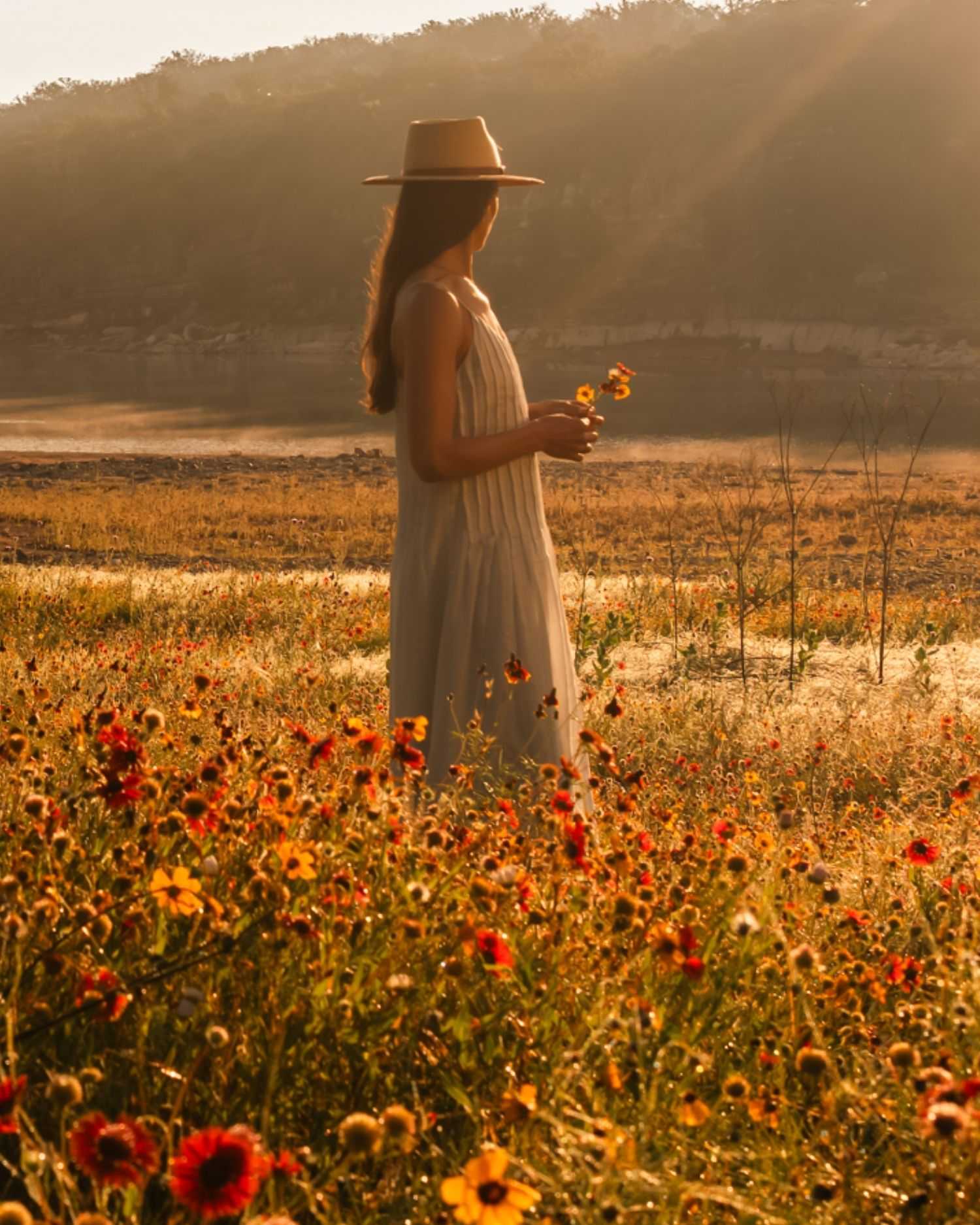 a woman in a wildflower field