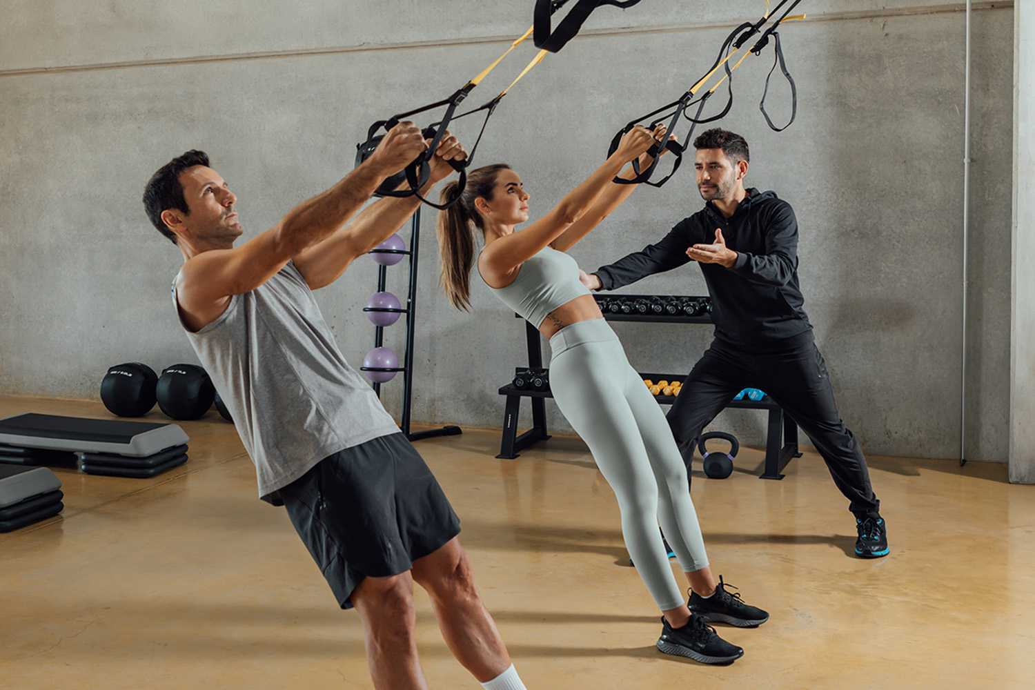 Man and Woman During a Strength Training Session with a Personal Trainer