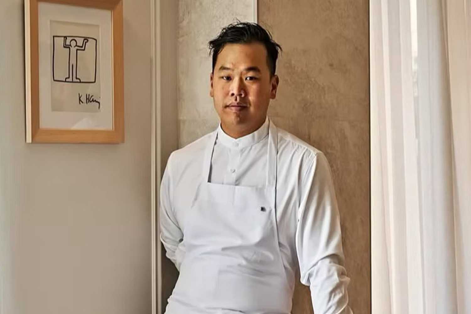 Photo of Chef Buddha Lo Standing in a Restaurant With His Uniform 