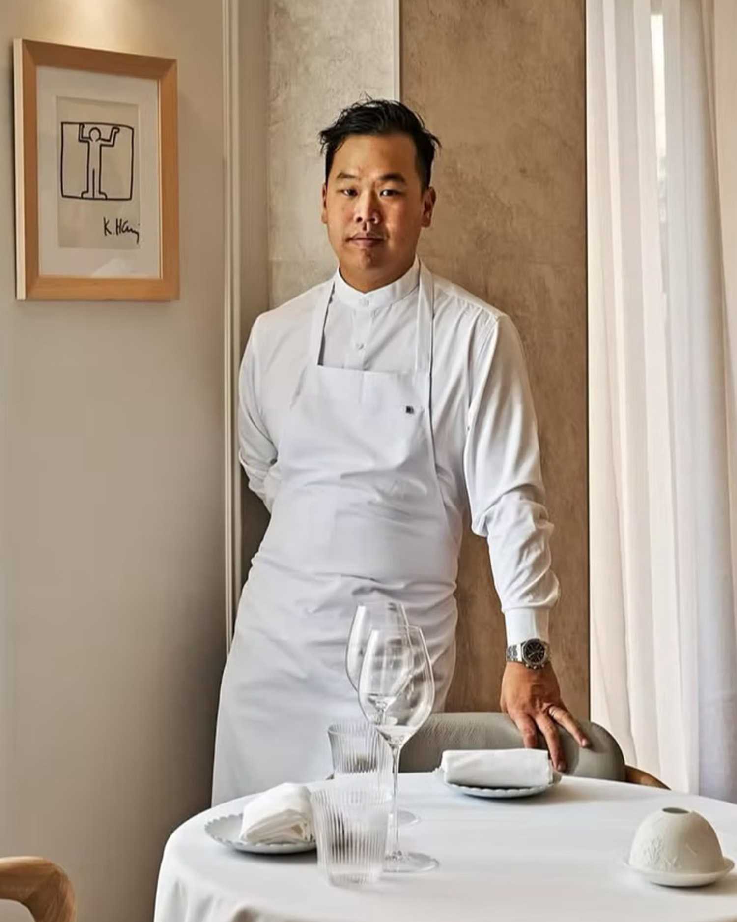 Photo of Chef Buddha Lo Standing in a Restaurant With His Uniform 
