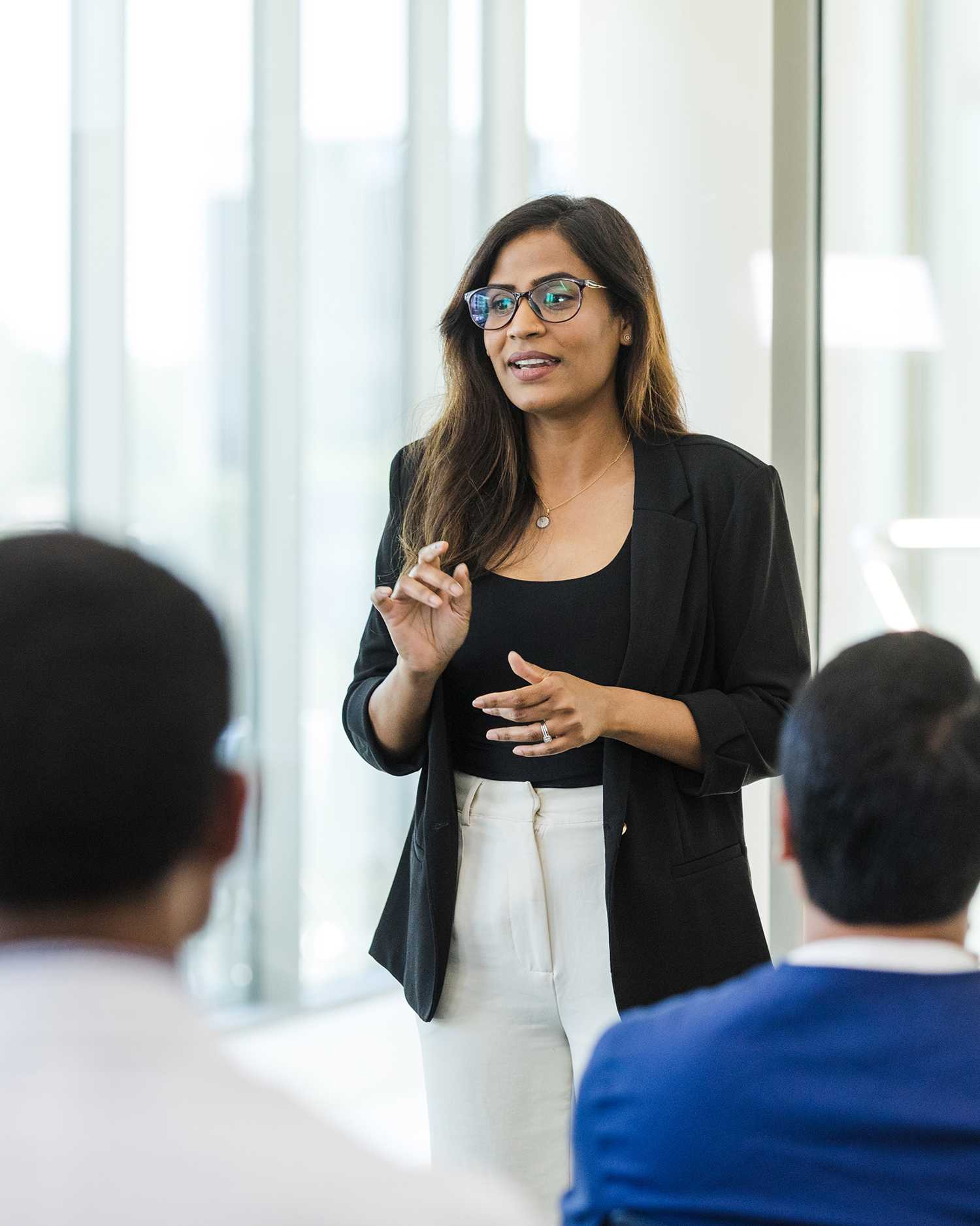 Female Physician Teaching a Class To Other Physicians 