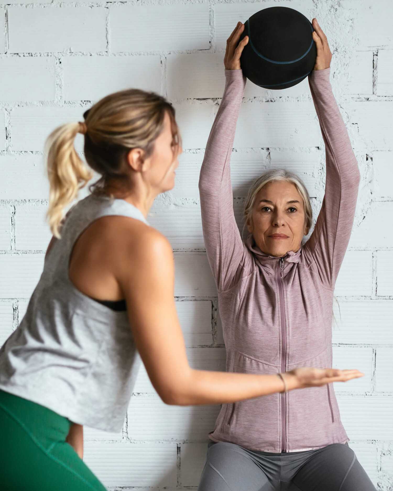 Woman Holding a Medicine Ball During Personal Training