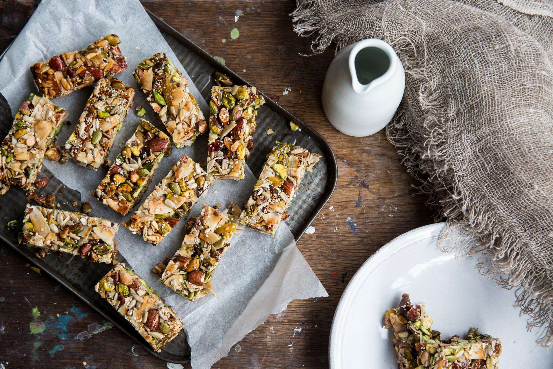 Overhead view of fruit and nut bars on tray.