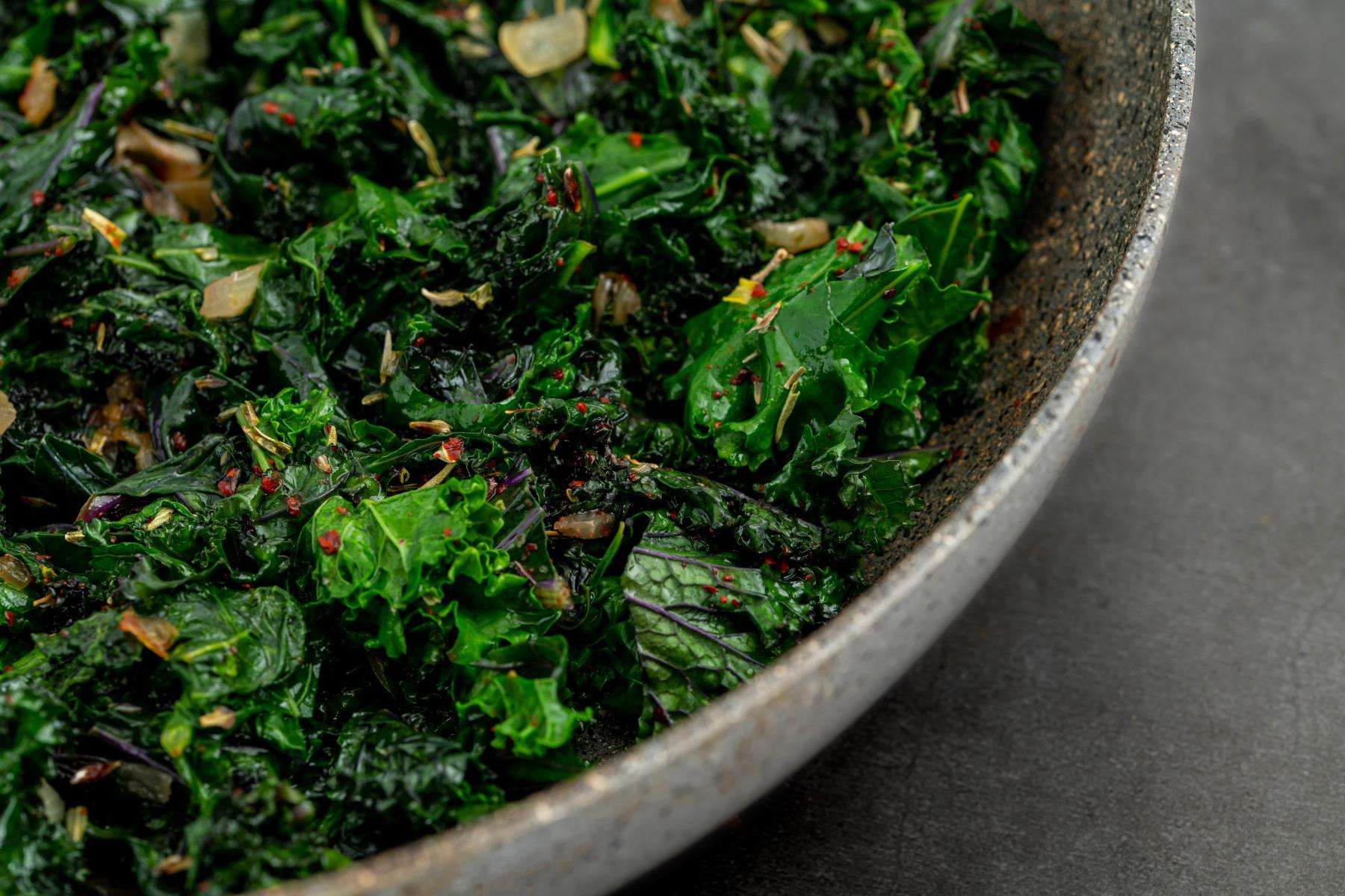 Close-up of a bowl of sautéed kale.
