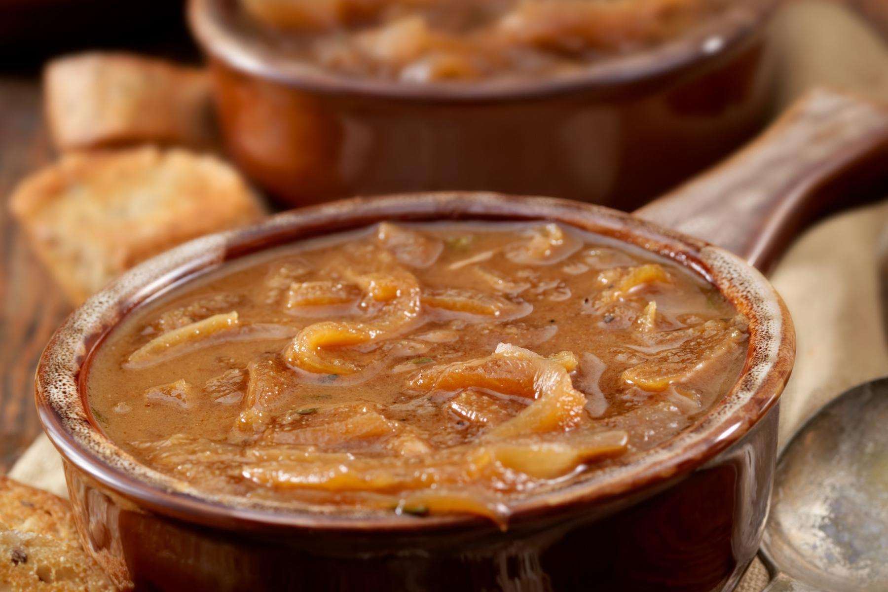 Close-up of a bowl of Spanish onion soup.