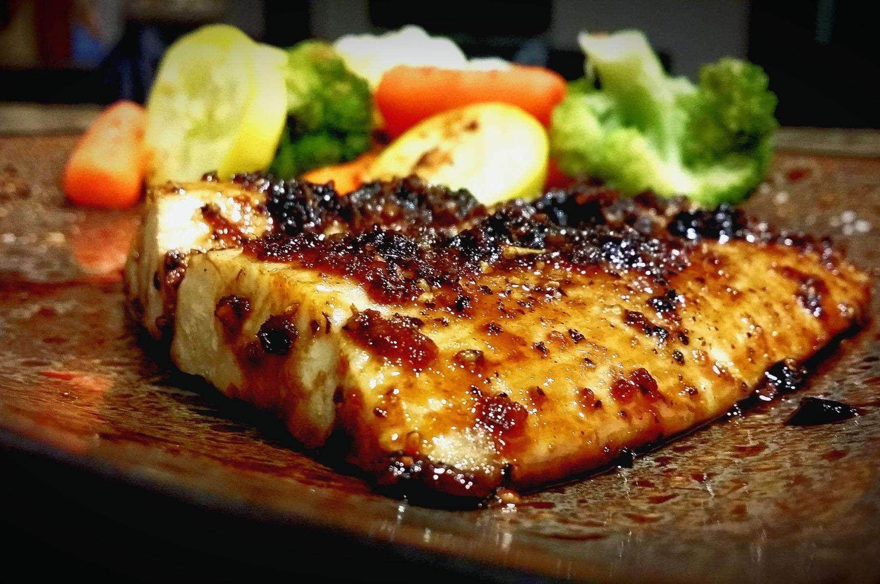 Wasabi crusted Mahi Mahi on cutting board.