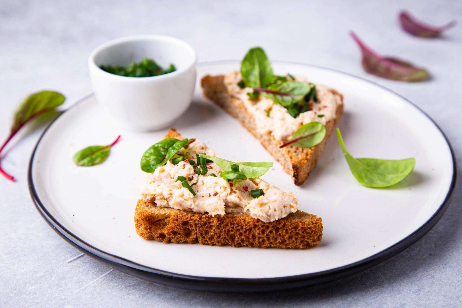 Open tuna sandwich on rye bread.