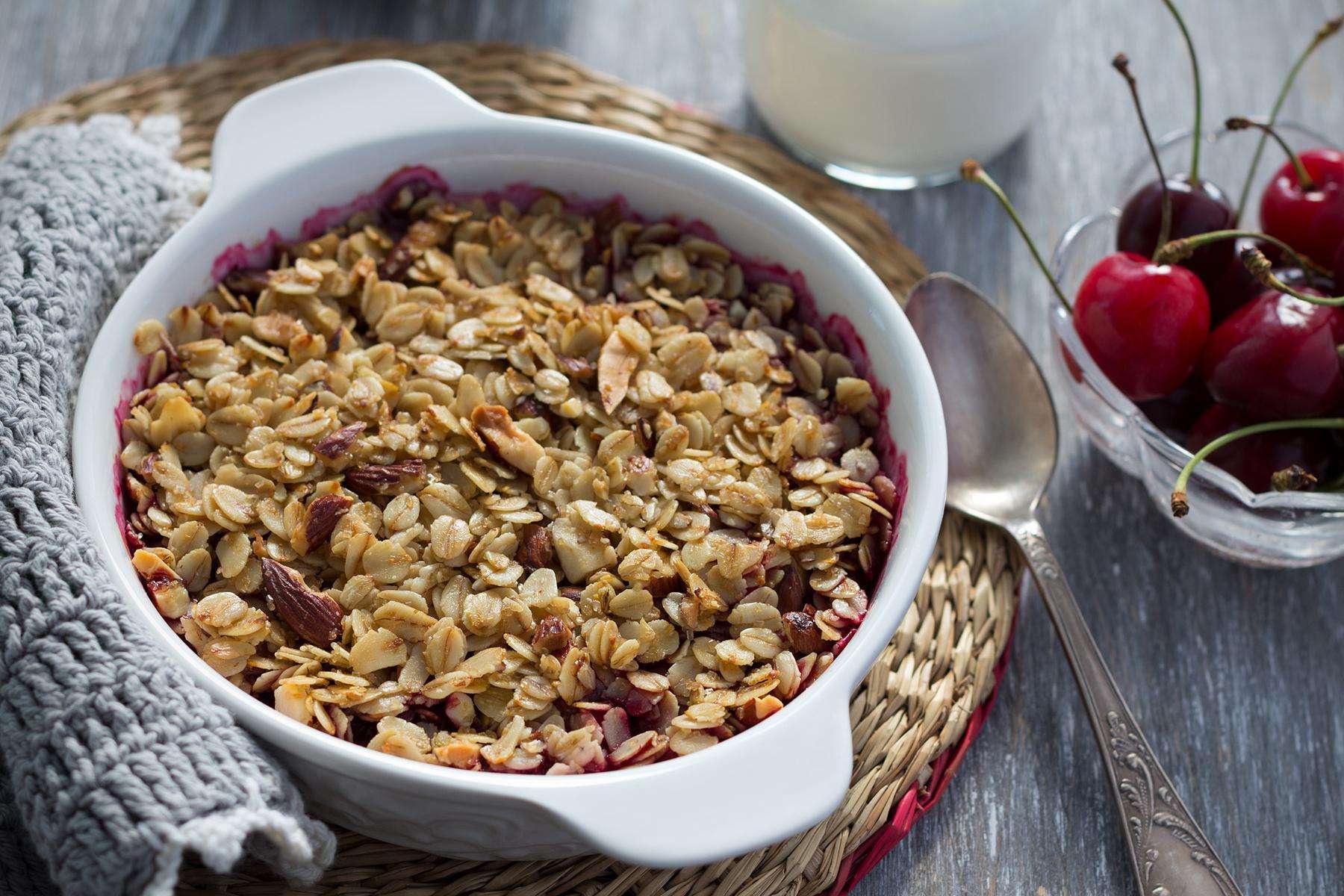a bowl of cherry almond baked oats
