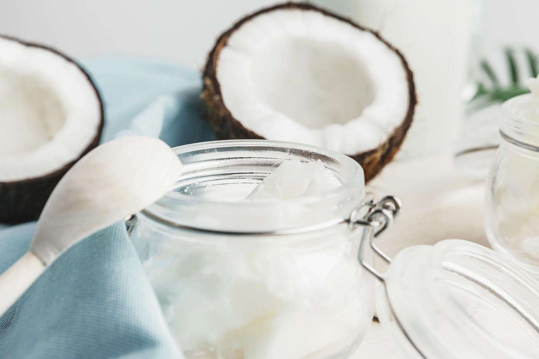 A glass container of coconut oil scrub.