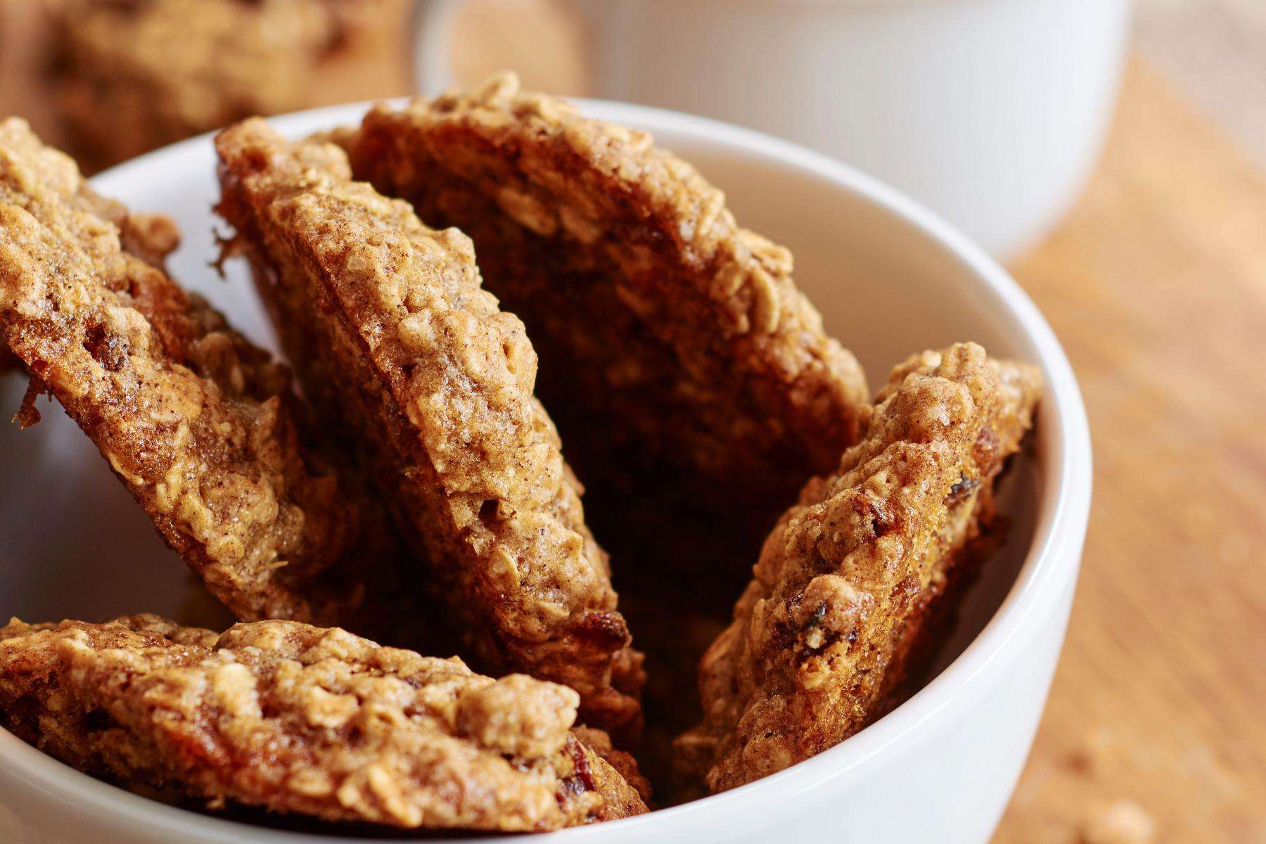 A bowl of 5 oatmeal cookies.