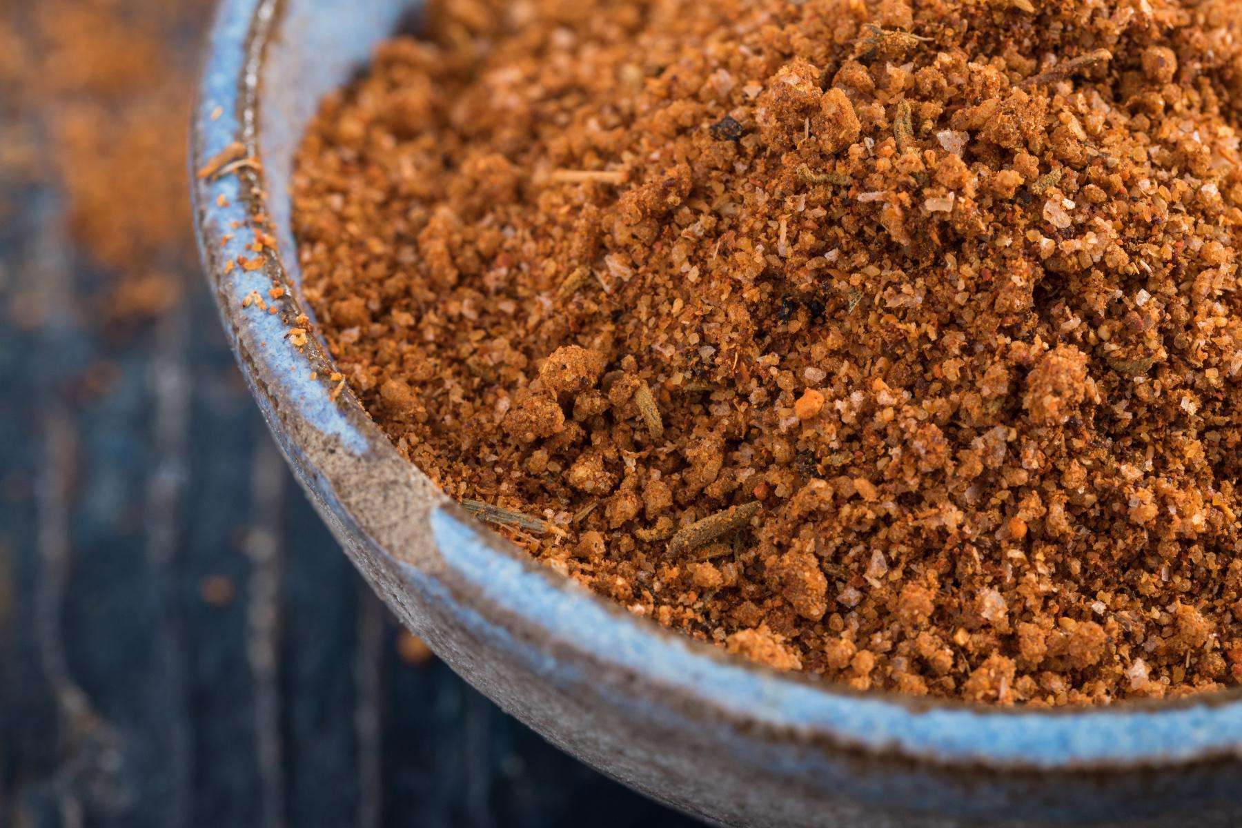 Close-up of a bowl filled with latin spice rub.