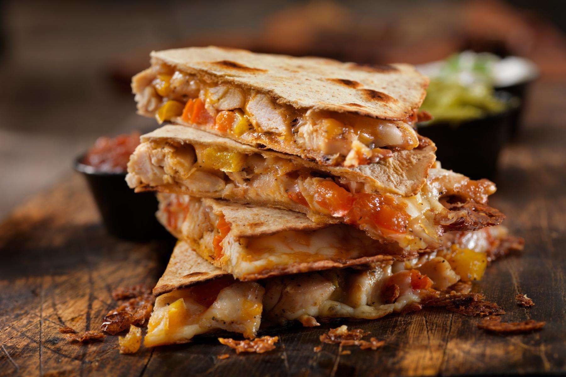 A plate of red chili chicken quesadillas.