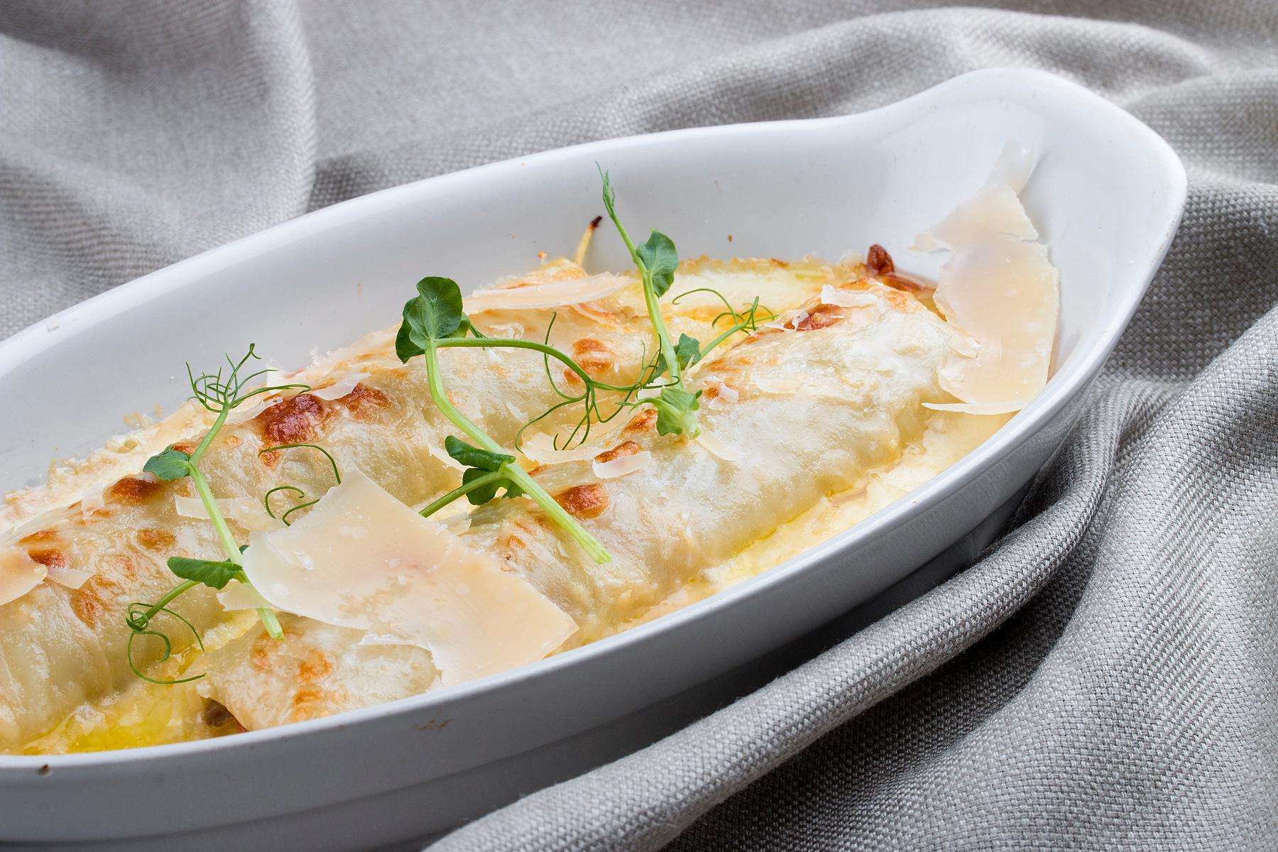 A pan of roasted vegetable manicotti.