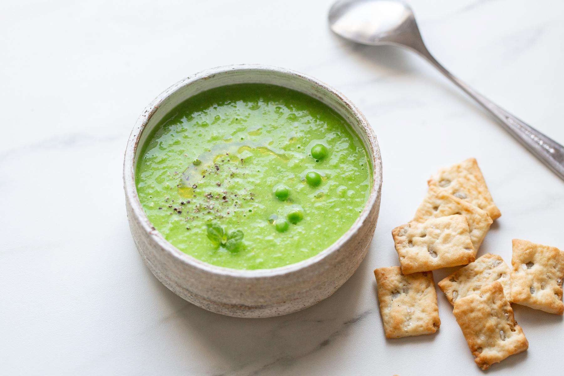 Overhead view of a bowl of spring pea soup.