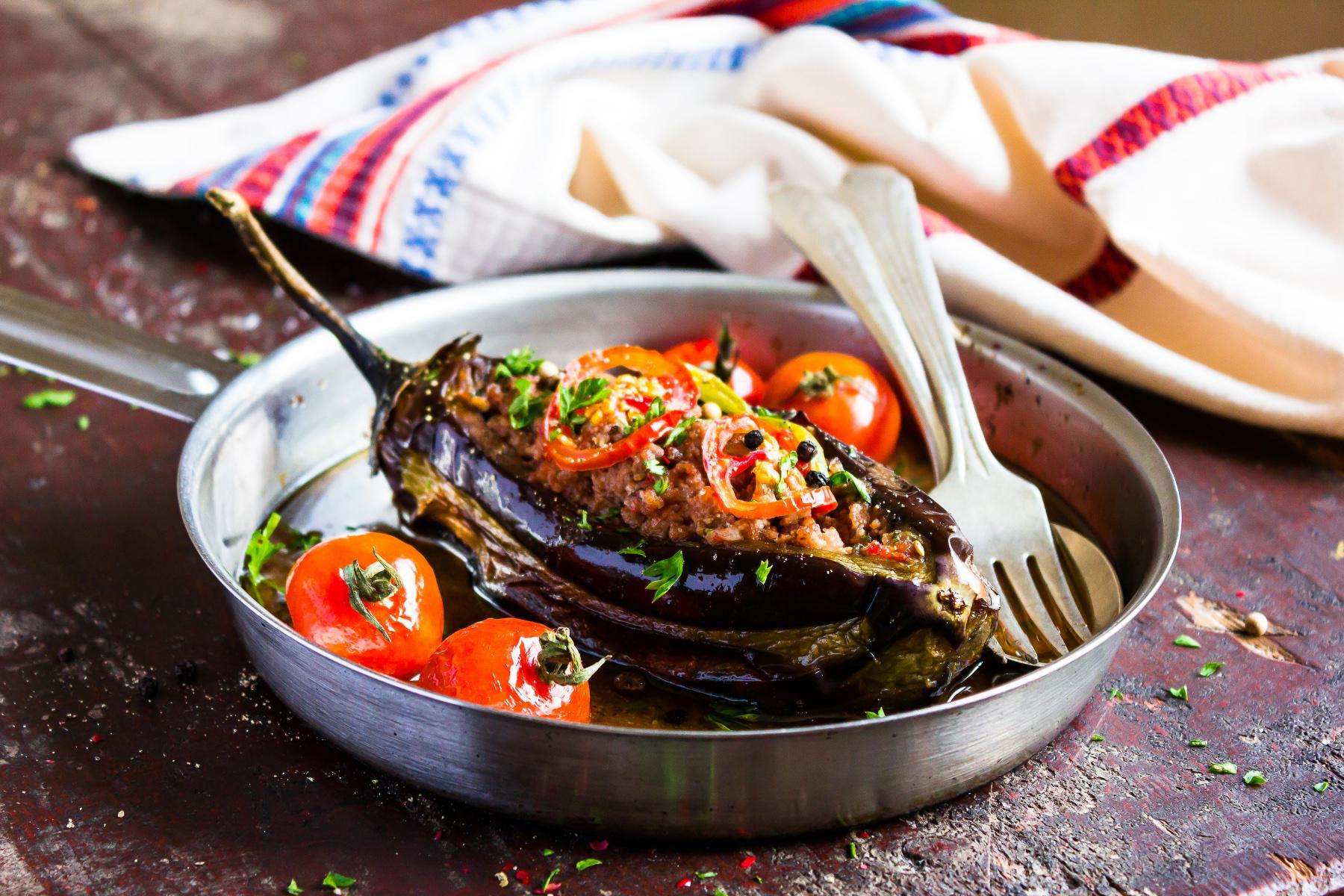 Stuffed eggplant in pan.