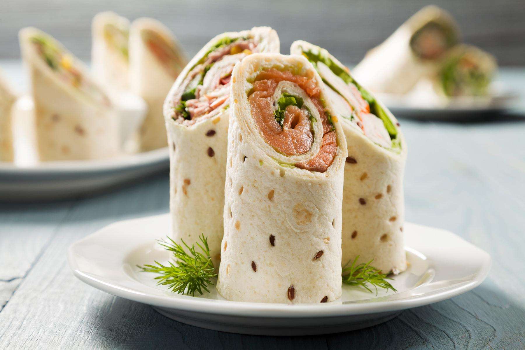 A plate of poached salmon wraps.