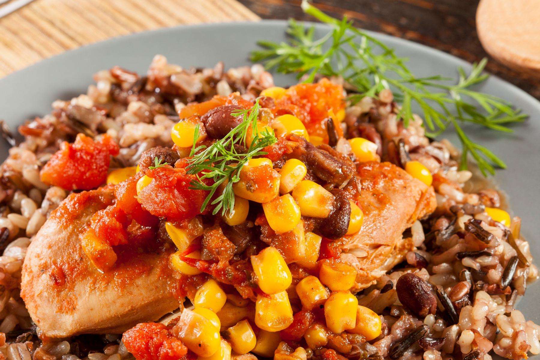 Close-up of lime marinated chicken with corn salsa on top.