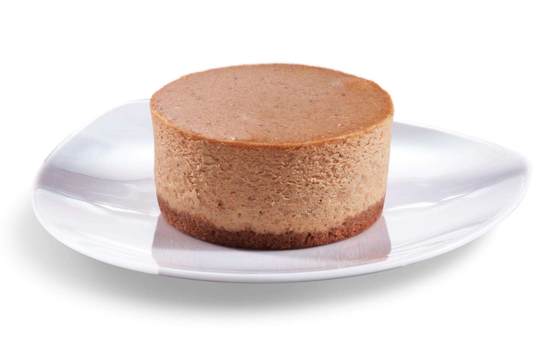 Mini pumpkin cheesecake on plate.